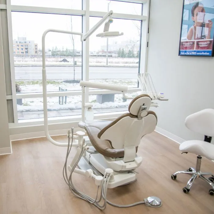 Bright, modern dental operatory with treatment chair at Yonge Forest Dental