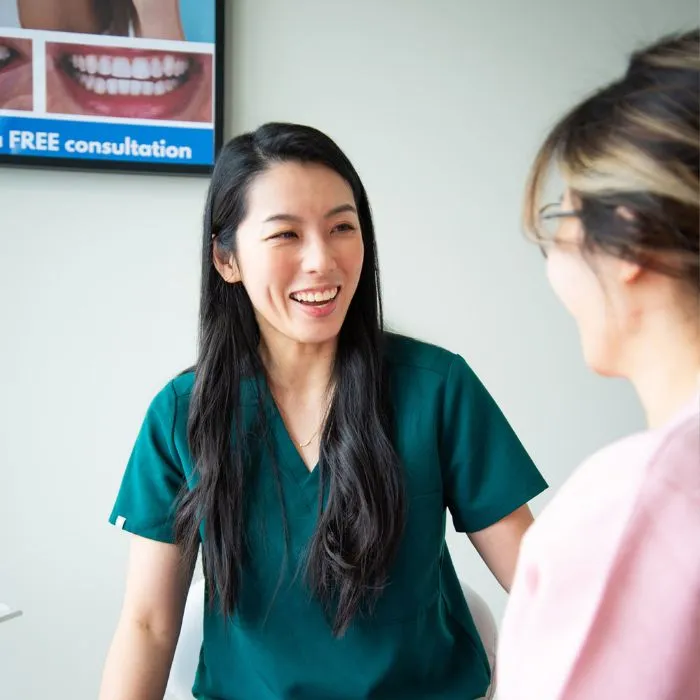 A dentist welcoming a patient at Yonge Forest Dental in Barrie