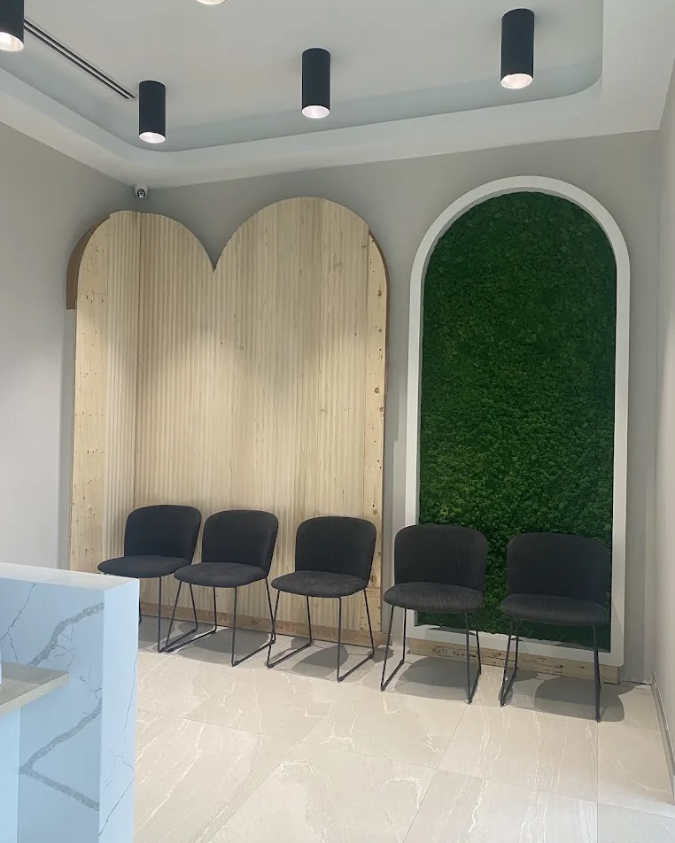 Level waiting area with open floor space and chairs at Yonge Forest Dental