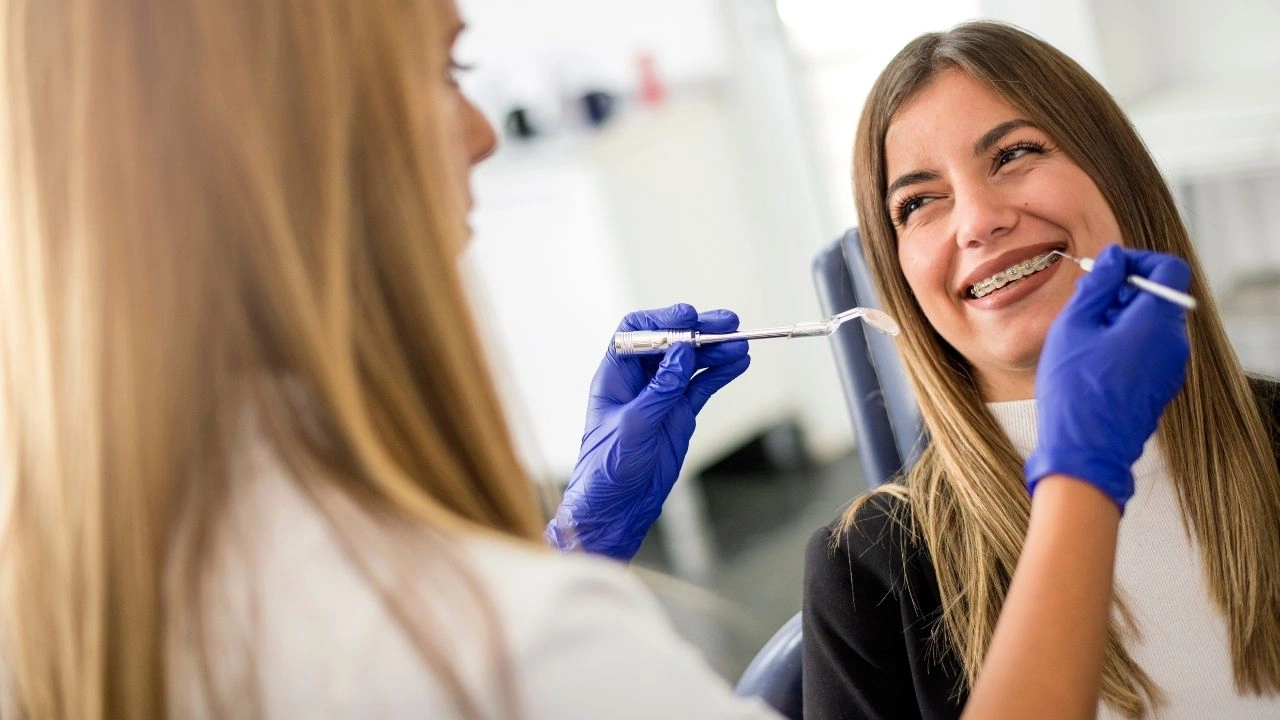 Teen patient smiling during orthodontic check-up with braces at Yonge Forest Dental in Barrie