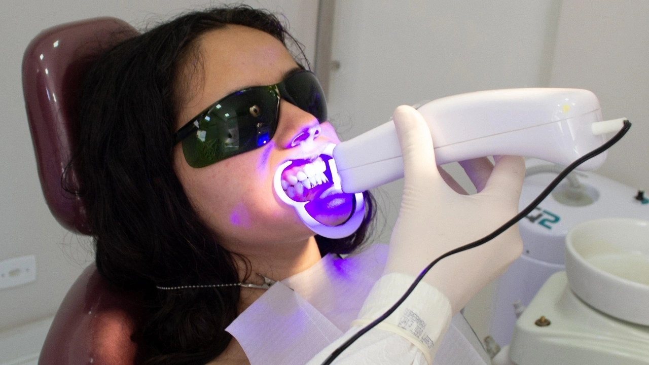 Patient undergoing professional LED teeth-whitening treatment at Yonge Forest Dental in Barrie, wearing protective eyewear while the dentist uses a blue-light whitening device.