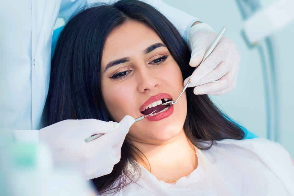 Patient receiving endodontic assessment with dental instruments at Yonge Forest Dental in Barrie
